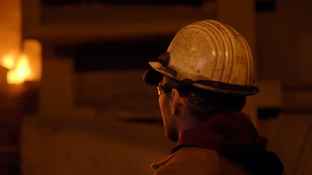 Metallurgist at work by the blast furnance, iron and steel works — Stock Video