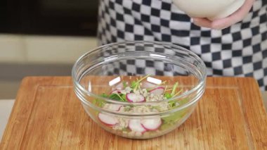 Chef is cooking salad with beetroot and radish