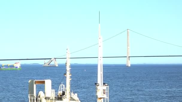 Long cable-stayed bridge with large pillars ropes silhouette — Stock Video
