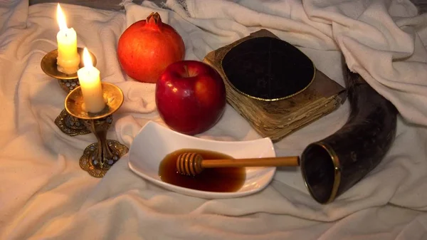 Jewesh holiday shofar, torah book, honey, apple and pomegranate rosh hashanah traditional holiday symbols. 4k video