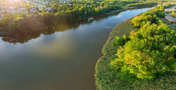 Aerial view of river and beautiful garden park with trees