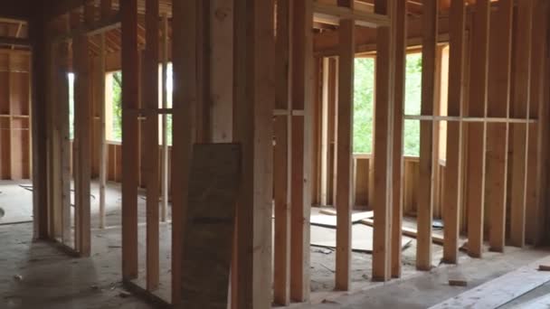 Wood framing work in progress with wood framing walls and ceiling or floor joist on new construction building — Stock Video