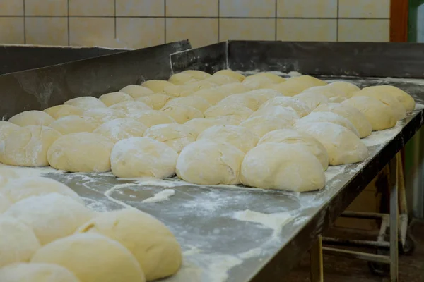 Balls of dough. Balls on the table fresh raw dough for bread baking