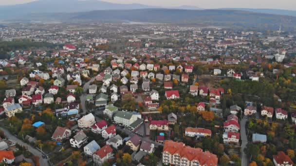 Aerial view of middle class houses in small village or town in the countryside. Top view above houses at sunrise Uzhhorod Ukraine Europe — Stock Video