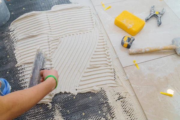 stock image Floor tiles installation. Ceramic tiles and tools for home improvement, renovation