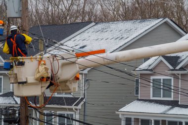 Repairing power lines after on them in snow storm damage, electricity clipart