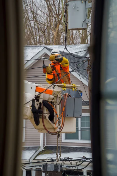 Electric power line crews make repairs long after a snow storm