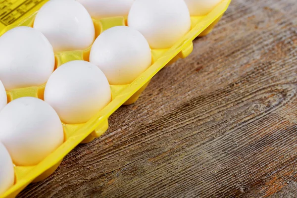 Chicken organic eggs in the cell egg yellow tray