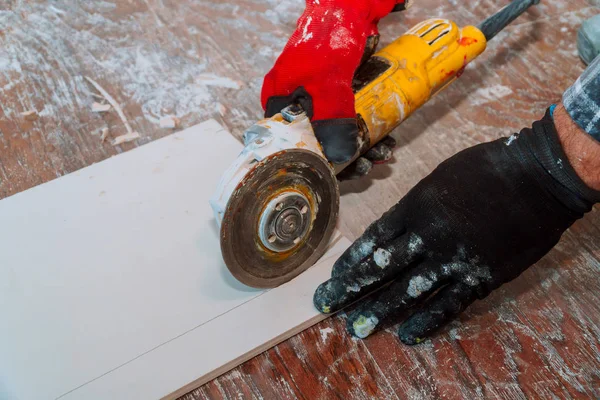 Side grinder working on paving tile on building site — Stock Photo, Image