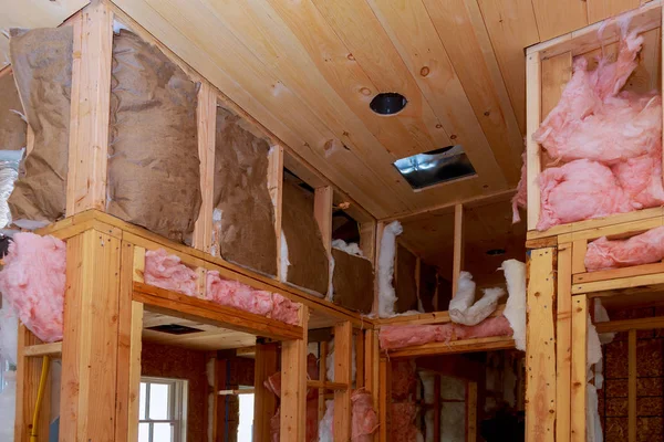 Inside wall heat isolation with mineral wool in wooden house, building under construction — Stock Photo, Image