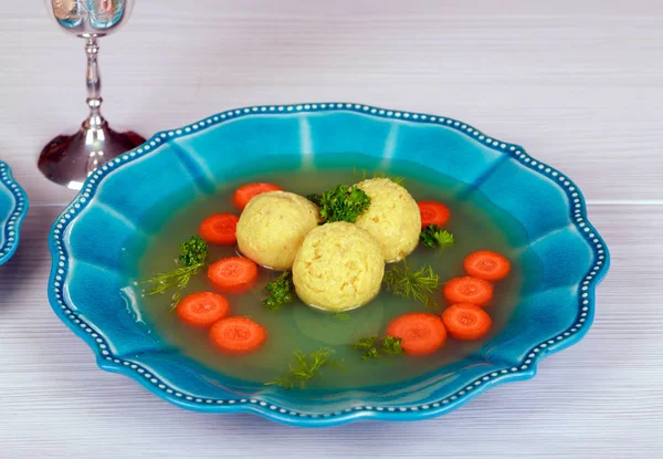 Matzoh ball soup with Pesach Passover symbols — Stock Photo, Image
