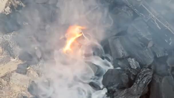 Preparing for grilling burning charcoal and flame glowing burn, charcoal used as a cooking fire flame — Stock Video