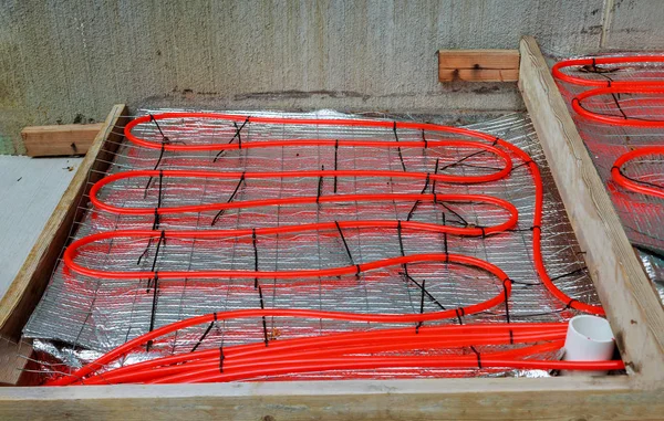 Water underfloor heating pipes posed in a under construction building