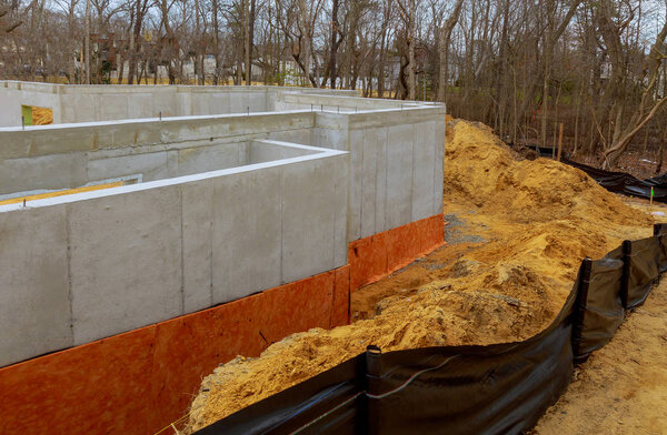 The cement basement foundation of a new housing development.