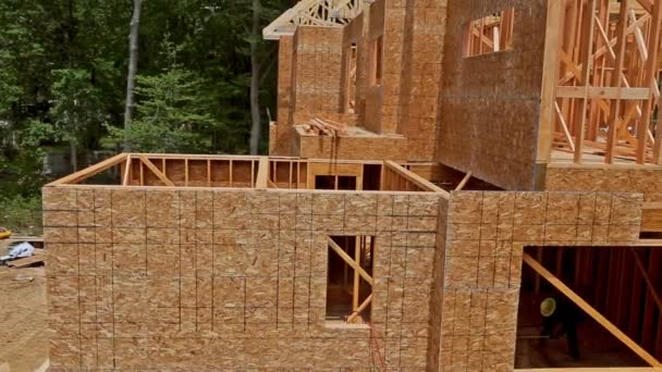 House timber frame for a progressing house a new development timber — Stock Footage House timber frame for a progressing house a new development timber Royalty Free Stock Video