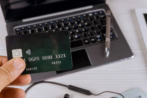 Hands holding credit card using laptop with online shopping — Stock Photo, Image