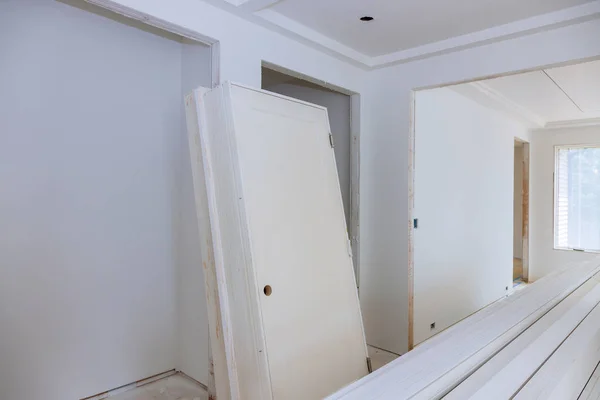 Interior construction of housing project with door and molding installed — Stock Photo, Image