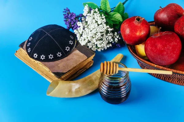 Apple and honey, traditional food of jewish New Year Rosh Hashana torah book, kippah yamolka
