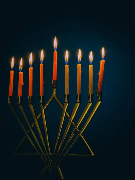 Nine burning candles on dark blurred background, close-up. Hanukkah concept — Stock Photo, Image