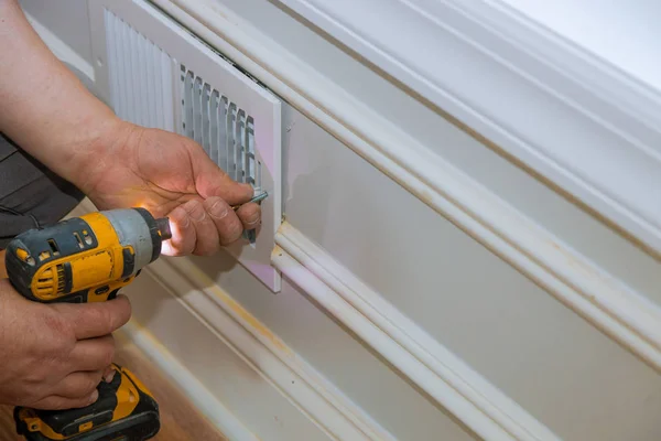 Ventilation cover construction of building worker builder installing — Stock Photo, Image