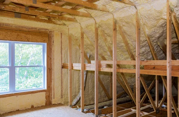 Wall of an apartment attic, covered with insulation foam before — Stock Photo, Image