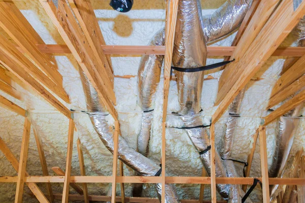 New home construction with installation of heating system on the roof of the pipe — Stock Photo, Image