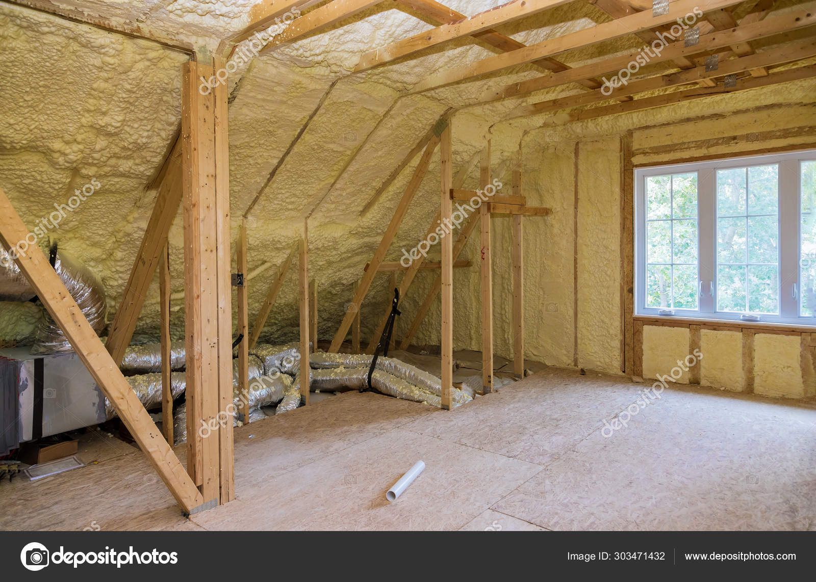 Foam Plastic Insulation Installed In The Sloping Attic Of New
