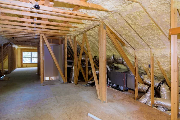 Foam plastic insulation installed in the sloping attic of new frame house. — Stock Photo, Image