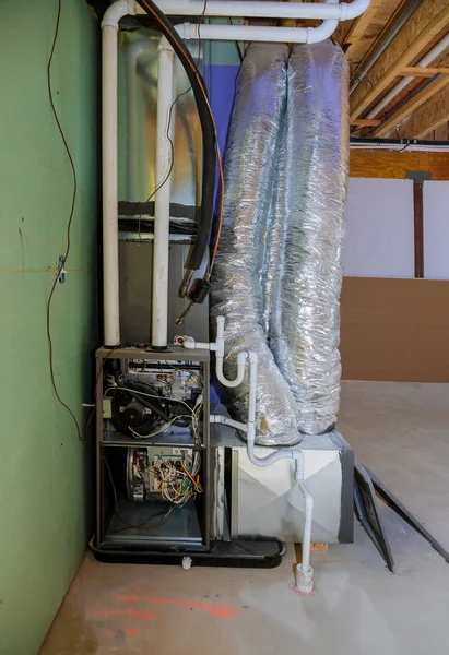 Installation of heating system on the basement of the pipe system of heating closeup