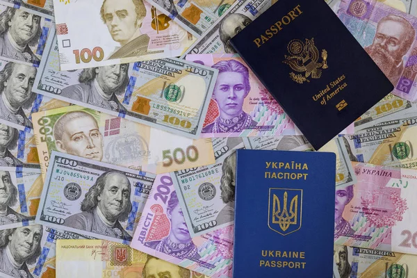 New blue Ukrainian electronic passport of dual citizens and American passpor let Ukrainian hryvna, American dollar bill — Stock Photo, Image