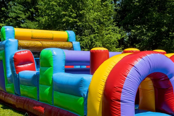 Children ride on an inflatable, children attraction fragment — Stock Photo, Image