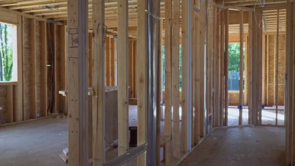 Looking up new construction beams under with some framed wall up — Stock Video