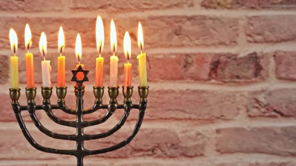 Brightly Glowing Hanukkah Menorah Shallow Depth of Field — Stock Video