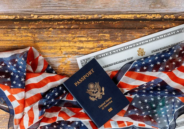 USA passport and naturalization certificate of citizenship US flag over wooden background — Stock Photo, Image