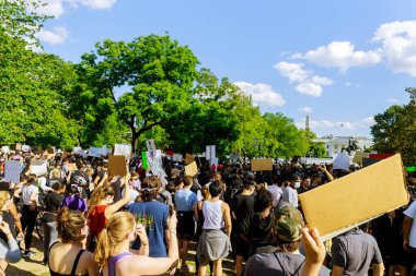 WASHINGTON D.C., USA - MAY 31, 2020: Protest Black Lives Matter protesters march after death George Floyd, group standing against White House Donald Trump president US clipart