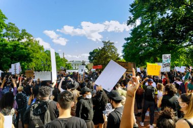 WASHINGTON D.C., USA - MAY 31, 2020: Protest after George Floyd death, Black Lives Matter group standing against White House president Donald Trump clipart