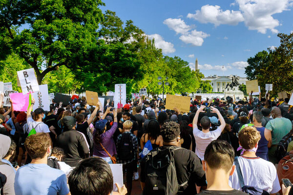 WASHINGTON D.C., USA - MAY 31, 2020: Protesters march in WASHINGTON D.C. during a rally responding to the death of Minneapolis man George Floyd at the hands of police on White House president Donald Trump