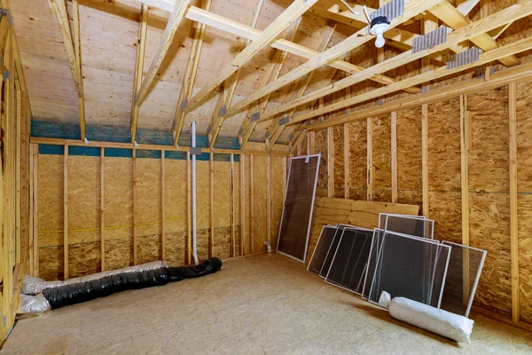 Beam framework frame house attic under construction interior inside a frame walls and ceiling in wooden material
