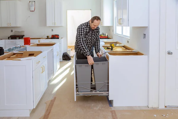 Blind cabinet and drawers garbage trash can counter cabinets in the kitchen installed of white color