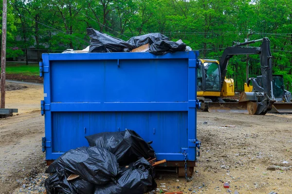 Truck loading a full recycling container trash dumpsters being with garbage container trash