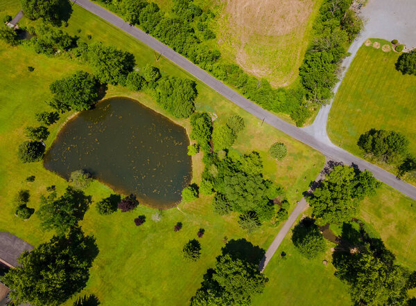 Aerial view beautiful farm fields landscape lake from above from a height land