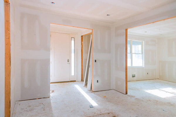 Interior construction of housing project with door installed construction materials
