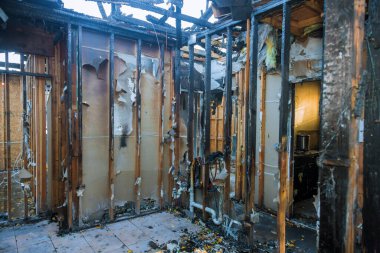 Burnt wooden walls house with charred roof burnt fire damaged interior details clipart