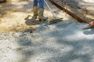 Process of installing construction of new sidewalks laying concrete cement clipart