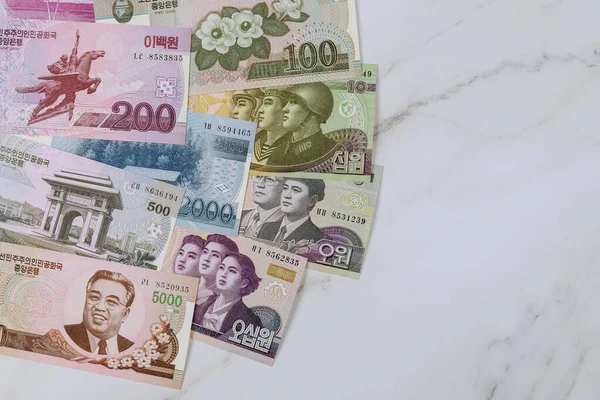 Various banknotes of North Korean won KPW , currency bill