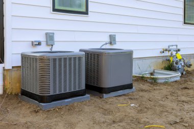 Air conditioning system unit installed outside facade of the new house clipart
