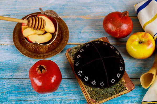 A jewish new year with honey for the apple and pomegranate holiday of Rosh Ha Shana Jewish prays