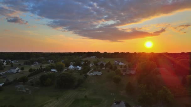 View of scenic small village ondramatic sunset over fields landscape on Akron Ohio — Stock Video