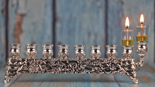 Orthodox jewish light a hanukkah menorah with candles. — Stock Video