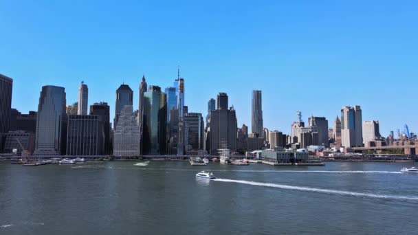 Beautiful aerial view of lower Manhattan cityscape across Hudson river New York USA of across Brooklyn Bridge through — Stock Video